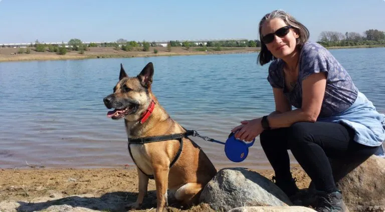 Woman with dog at lake