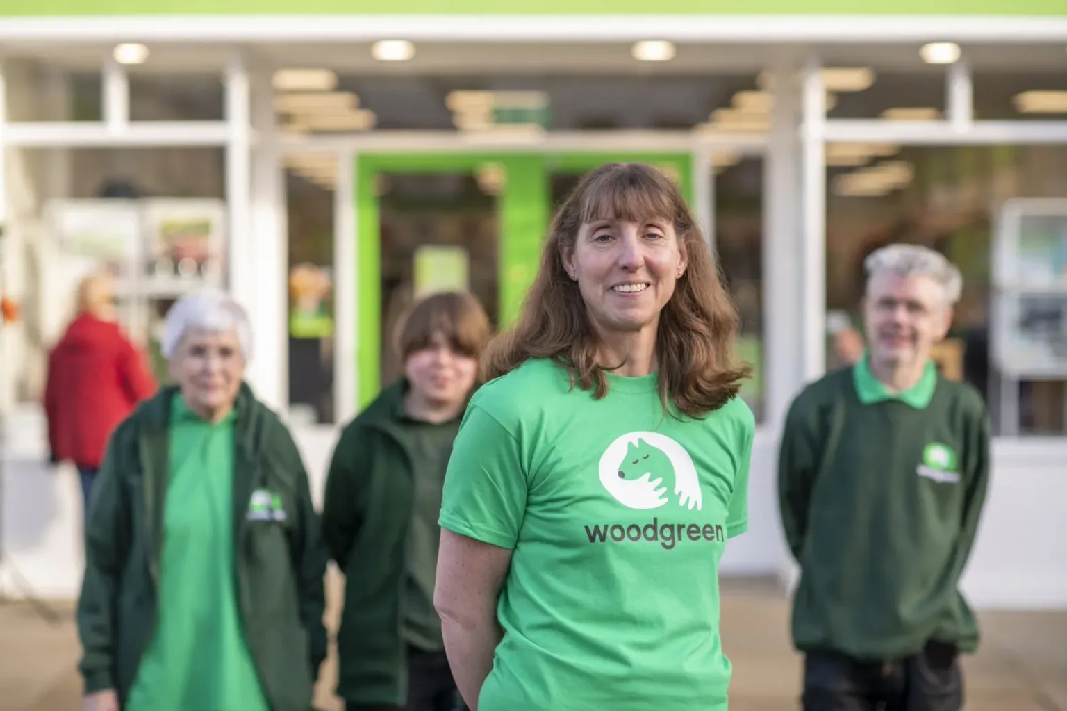 Woodgreen volunteers outside charity shop