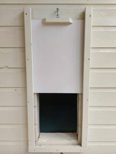 Pop hole between shed and run for poultry