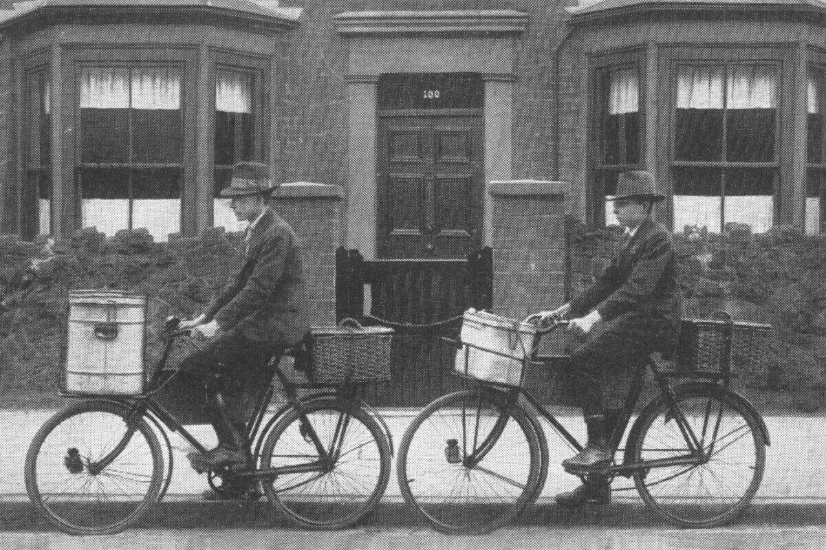 A black and white photo of two Woodgreen men on ambulance bikes, with the caption "Off - on errands of mercy."