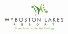 Logo for Wyboston Lakes Resort featuring green abstract shapes above the name, reflecting a commitment to sustainability. The tagline below reads: “More Sustainable. No Apology.” Ideal for eco-conscious corporate fundraising events.